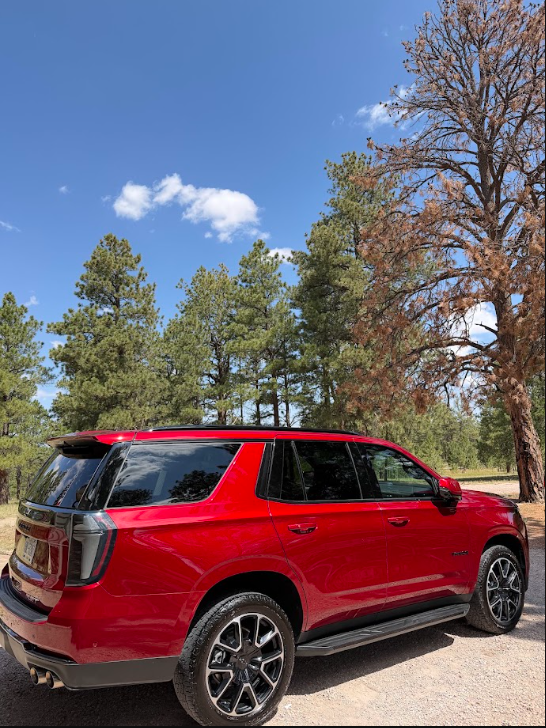 Red Chevy Tahoe with deep glossy paint after an exterior detail